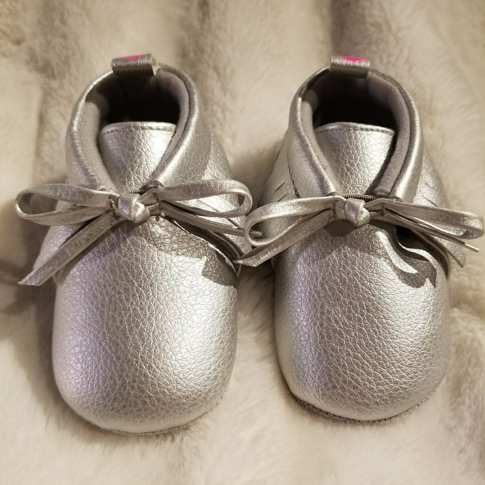 Silver baby shoes